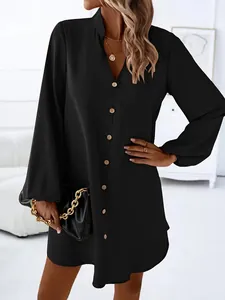 Detailed shot of a black V-neck long sleeve button-down A-line mini dress for women
