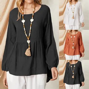 Casual loose babydoll blouse with lantern sleeves, available in black, white, and orange