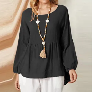 Elegant black plus size baby doll top featuring lantern sleeves and cotton linen texture
