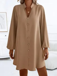 Detail view of khaki solid color V-neck button down long sleeve A-line dress