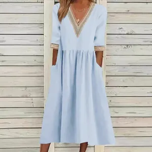 Loose cotton linen light blue mid-length dress with lace V-neck and handy side pockets