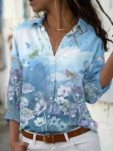 Detailed view of women's blue floral and butterfly print long sleeve lapel button-up blouse