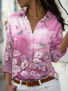 Detailed view of the pink floral and butterfly print on the women's long-sleeved shirt