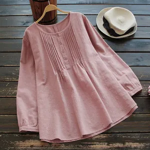 Detailed view of a dusty rose slub cotton linen blouse with elegant front pleated accents.