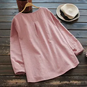 Detailed back view of a pink loose linen cotton blouse with elegant pleated round neck