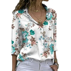 Elegant white long sleeve button down shirt featuring a vibrant teal floral print
