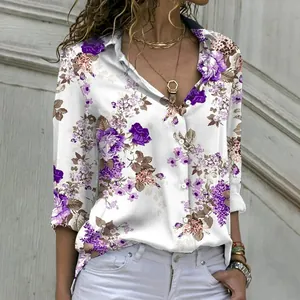 Detailed view of elegant women's loose long-sleeve shirt with purple floral prints