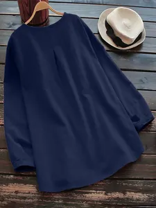 Detailed back view of a navy blue cotton linen loose round neck blouse on hanger