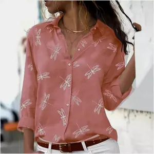 Detail view of women's long sleeve button-up shirt with elegant white dragonfly print