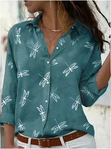 Detail shot of a loose long-sleeve shirt with lapel collar and dragonfly print.