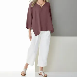 Loose maroon V-neck linen blouse with side slits and three-quarter sleeves