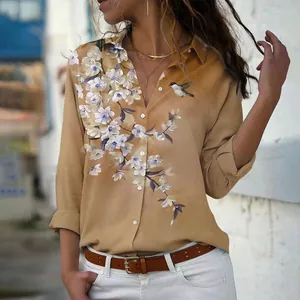 Close-up of women's elegant khaki floral print long sleeve blouse with button design