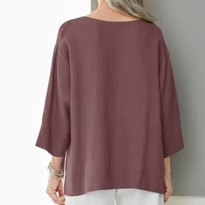 Back view of a loose mauve cotton linen shirt featuring side slits and 3/4 sleeves for women.