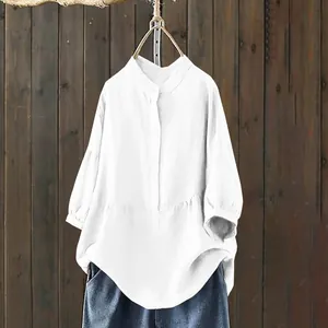 Detail of white stand collar blouse with single-breasted buttons and loose fit