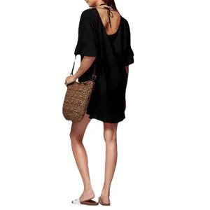 Black ruffled beach cover-up dress with V-back tie and loose fit for summer vacation.