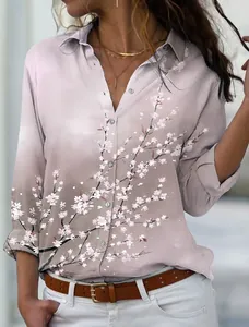 Close-up detail of a mauve long-sleeve shirt with delicate cherry blossom floral printing.