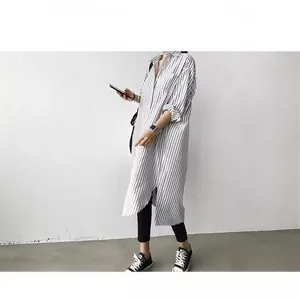 Stylish women's vertical striped longline shirt with a loose fit and side slits for spring