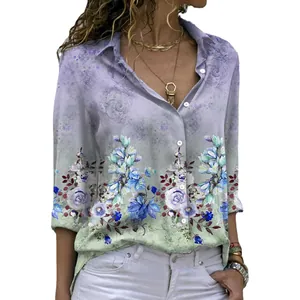 Detail view of women's loose long-sleeved shirt with elegant floral print and button-down lapel