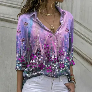 Close-up detail of a purple floral long-sleeve blouse with a lapel collar and buttons.