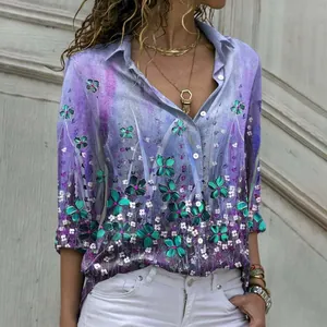 Close-up detail of elegant purple floral print long sleeve button down shirt with lapel