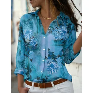 Detailed macro view of a casual blue floral print long sleeve button up shirt for women