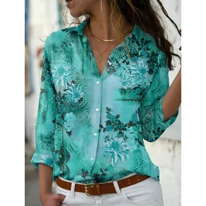 Detail shot of turquoise floral print long sleeve button-up shirt with elegant lapel collar