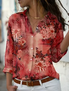 Detailed shot of women's red floral print long sleeve button-down shirt on model outdoors