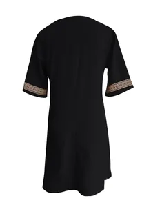Detailed view of the back and lace sleeve trim on a black cotton linen casual dress