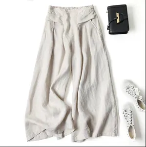 Elegant high-waisted cotton linen wide-leg pants with a relaxed drapey fit in beige