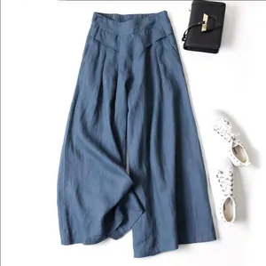 Stylish dusty blue cotton linen wide-leg pants with high waist and loose fit silhouette