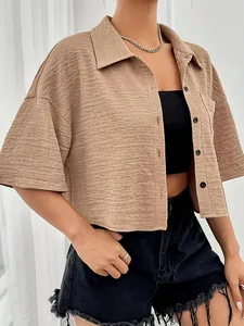Stylish beige cropped short-sleeve shirt with buttons and front pocket detail for women