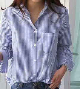 Close-up of blue and white vertical striped long sleeve blouse for professional women