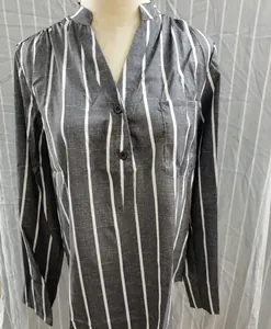 Close-up detail of a grey and white vertical striped women's shirt featuring a V-neck