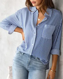 Detail of a blue and white striped long-sleeve button-down shirt for women.