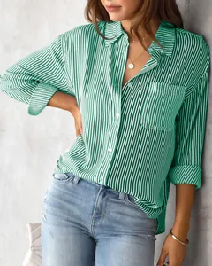 Detailed lifestyle shot of a women's green and white striped casual loose shirt