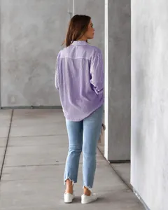Back view of a stylish women's purple and white striped loose fit long sleeve casual shirt