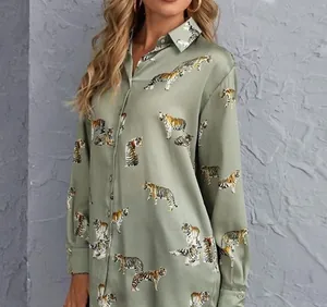 Close-up of sage green long-sleeved silk-feel shirt featuring all-over tiger print