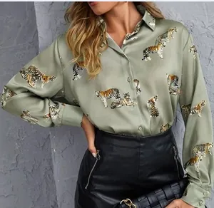 Detailed view of women's olive green long-sleeved shirt with realistic tiger print