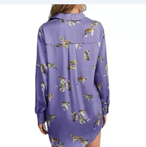 Detailed back view of a purple long-sleeve silk shirt featuring bold tiger print patterns.