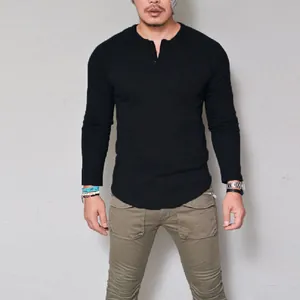 Slim fit men's black long sleeve cotton Henley shirt with classic button placket detail