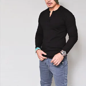 Close-up of a men's solid black long-sleeve cotton Henley t-shirt with button collar