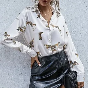 Women's long-sleeve button-down shirt featuring a vintage tiger print on white fabric.