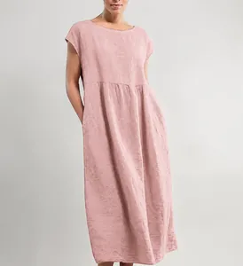 Detailed view showing the texture and side pockets of this pink sleeveless linen dress