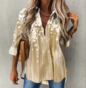 Detailed view of stylish women's long sleeve blouse featuring elegant white floral print