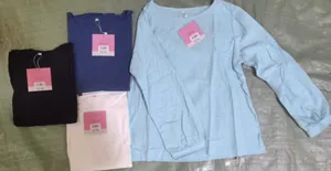 Pila de camisetas de manga larga de algodón y lino con cuello redondo para mujer