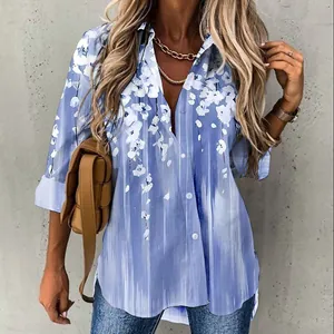 Women's blue and white floral print long sleeve button-up shirt in a casual street style.