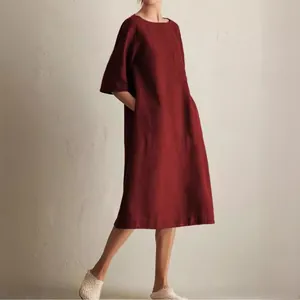 Elegant burgundy round neck mid-sleeve linen midi dress with functional side pockets.