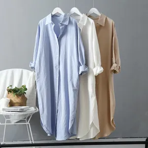 Oversized cotton linen button down mid length shirt displayed in blue white and tan