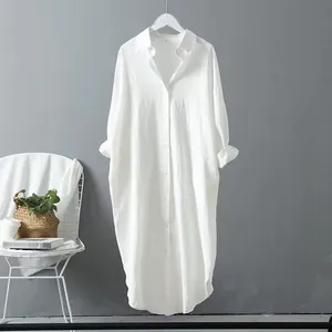 Detailed view of the white oversized cotton linen mid-length button-down shirt dress