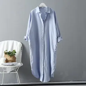 Light blue oversized cotton linen shirt dress with button-up front and curved hem details